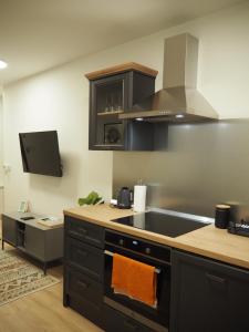 a kitchen with a sink and a stove at Apartment Simon in Zagreb