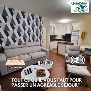a living room with a couch and a table at QuietStay 20' PARIS, Connected HOME avec Terrasse in Massy