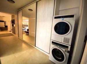 a washer and dryer in a room at GEORGIANA in Buzău