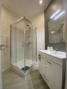 a bathroom with a shower and a sink at Urban 44 Guest House in Ponta Delgada