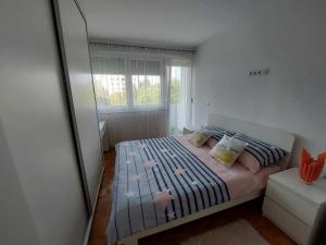 Postel nebo postele na pokoji v ubytování Apartman OMANOVIĆ