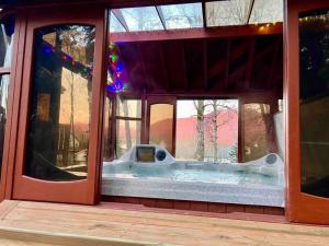 a bath tub in the window of a house at An upscale modern 4 bedroom 2 bath home with Mountain views in Anchorage