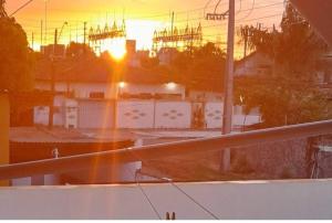 a view of the sunset from a balcony of a building at Sobrado_Familiar in Boa Vista