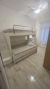 two bunk beds in a room with a tile floor at Apartamento Alberdi 1634 in Buenos Aires
