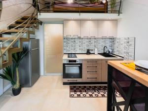 Kuchyň nebo kuchyňský kout v ubytování Fantasy Apartment + 23 fotografií