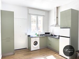 Kuchyň nebo kuchyňský kout v ubytování Apartamentos Blanco & Negro