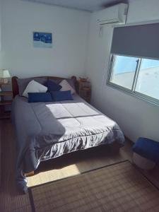 Кровать или кровати в номере RELAX HOUSE PUNTA DEL DIABLO