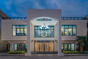 a facade of a building with a chandelier at Protea Hotel by Marriott Lagos Kuramo Waters in Lagos