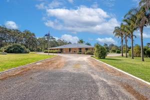 an empty road in front of a house at 101 Oatlands in Mount Barker