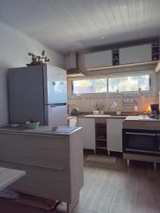 Кухня или мини-кухня в RELAX HOUSE PUNTA DEL DIABLO
