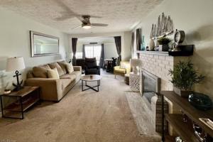 a living room with a couch and a fireplace at Lakeview - Lake Erie - Ashtabula, OH - 5 Min to GOTL - Fireplace- Deck - King Bed in Ashtabula +24 photos