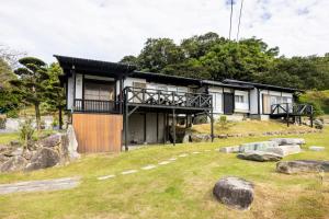 Zahrada ubytování Keiko"s Home 宮浦一日一組限定海の絶景オーシャンビューのラグジュアリー別荘2000m2BBQ可海釣公園