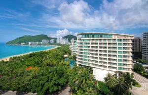 an aerial view of a hotel and the beach at Sunshine Resort Intime Sanya in Sanya