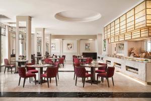 a restaurant with tables and chairs in a room at Nha Trang Marriott Resort & Spa, Hon Tre Island in Nha Trang