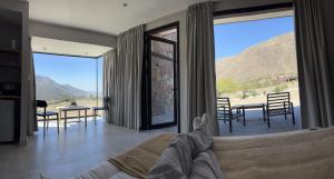 a living room with a view of a mountain at La Morada in Purmamarca