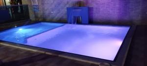 a large pool of water in a room at Ukiyo Cabin in Santa Marta