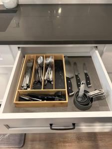 a drawer in a kitchen with utensils in it at A Lovely Retreat in St Paul in Saint Paul