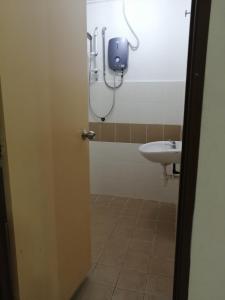 a bathroom with a toilet and a sink at Irdina Muslim's Homestay Brinchang in Brinchang