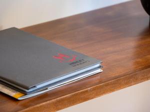 a stack of notebooks sitting on top of a table at Gippsland 12 in Jindabyne