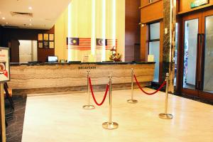 a lobby with red ribbon barriers in front of a hotel at Imperial Heritage Hotel Melaka I City Centre I Free Wifi I Free Parking l Free Club Lounge Access in Malacca