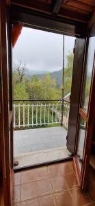 an open door to a balcony with a view at Casa Sofia in Pamparato