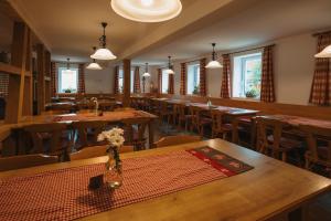 a dining room with wooden tables and chairs at Boutique Hotel Haus Marie in Gerabronn +72 photos