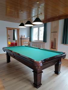 a pool table in the middle of a room at Ferienhaus Bergesblick in Lam
