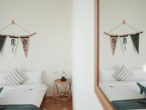Una cama o camas en una habitación de 亀居Kameshuku 寵物友善