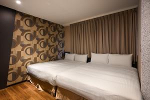 Postel nebo postele na pokoji v ubytování 綺樂文旅 康定館 Le Room Hotel Kangding