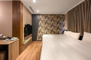 Postel nebo postele na pokoji v ubytování 綺樂文旅 康定館 Le Room Hotel Kangding