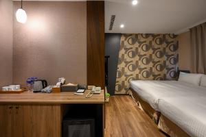 Postel nebo postele na pokoji v ubytování 綺樂文旅 康定館 Le Room Hotel Kangding
