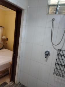 a shower in a room with a bed at Wahwik's House in Ubud +186 photos