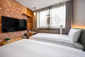 Postel nebo postele na pokoji v ubytování 綺樂文旅 康定館 Le Room Hotel Kangding