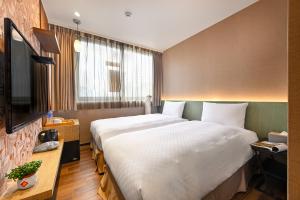 Postel nebo postele na pokoji v ubytování 綺樂文旅 康定館 Le Room Hotel Kangding