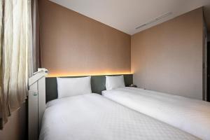 Postel nebo postele na pokoji v ubytování 綺樂文旅 康定館 Le Room Hotel Kangding