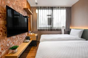 Postel nebo postele na pokoji v ubytování 綺樂文旅 康定館 Le Room Hotel Kangding