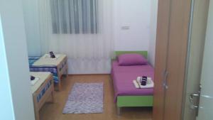Postel nebo postele na pokoji v ubytování Guest House Adriatic