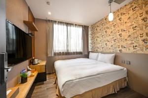 Postel nebo postele na pokoji v ubytování 綺樂文旅 康定館 Le Room Hotel Kangding