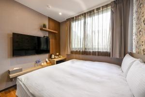 Postel nebo postele na pokoji v ubytování 綺樂文旅 康定館 Le Room Hotel Kangding