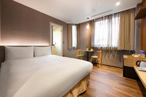 Postel nebo postele na pokoji v ubytování 綺樂文旅 康定館 Le Room Hotel Kangding