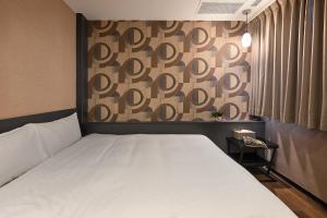 Postel nebo postele na pokoji v ubytování 綺樂文旅 康定館 Le Room Hotel Kangding