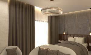 a bedroom with a bed and a chandelier at Elite World GO Van Edremit in Van
