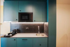Kuchyň nebo kuchyňský kout v ubytování Aparthotel Colombo Roma