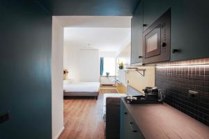 Kuchyň nebo kuchyňský kout v ubytování Aparthotel Colombo Roma