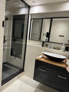 a bathroom with a sink and a glass shower at Zara at Saint Raphael France in Saint-Raphaël +12 photos