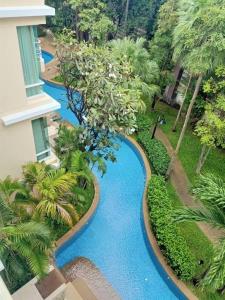 an overhead view of a swimming pool in a resort at Baan Sanploen. Unit 244 in Hua Hin