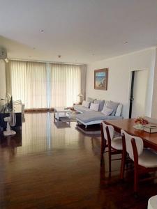 a large living room with a couch and a table at Baan Sanploen. Unit 244 in Hua Hin