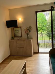 Μια τηλεόραση ή/και κέντρο ψυχαγωγίας στο Appartement T2 Jardins de Ramel