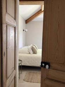 Postel nebo postele na pokoji v ubytování le Mas du Moulin