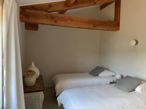 Postel nebo postele na pokoji v ubytování le Mas du Moulin